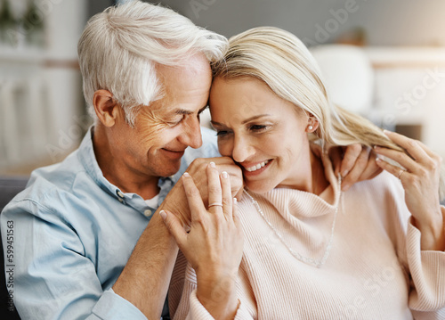 I only want to spend my life with you. a happy mature couple relaxing on the sofa at home.