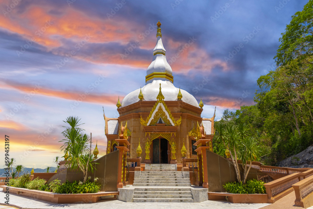Buddhist temples in Phuket Thailand. Decorated in beautiful ornate colours of red and Gold and Blue. Lovely sunset