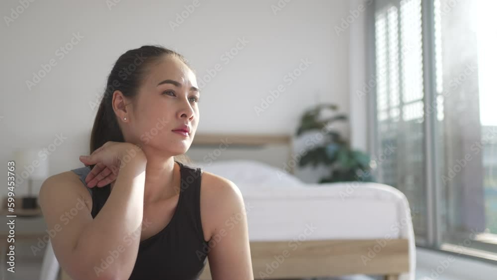 Woman plays yoga at home.