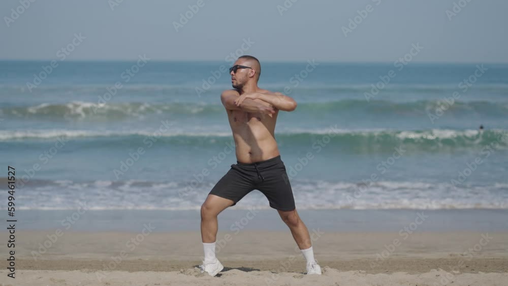 Handsome LGBT Queer Gay Man Male Dancer Dance on the Beach with Confidence Topless on a Blue Sunny Day Handsome LGBT Queer Gay Man Male Dancer Dance on the Beach with Confidence Topless on a Blue Sunny Day