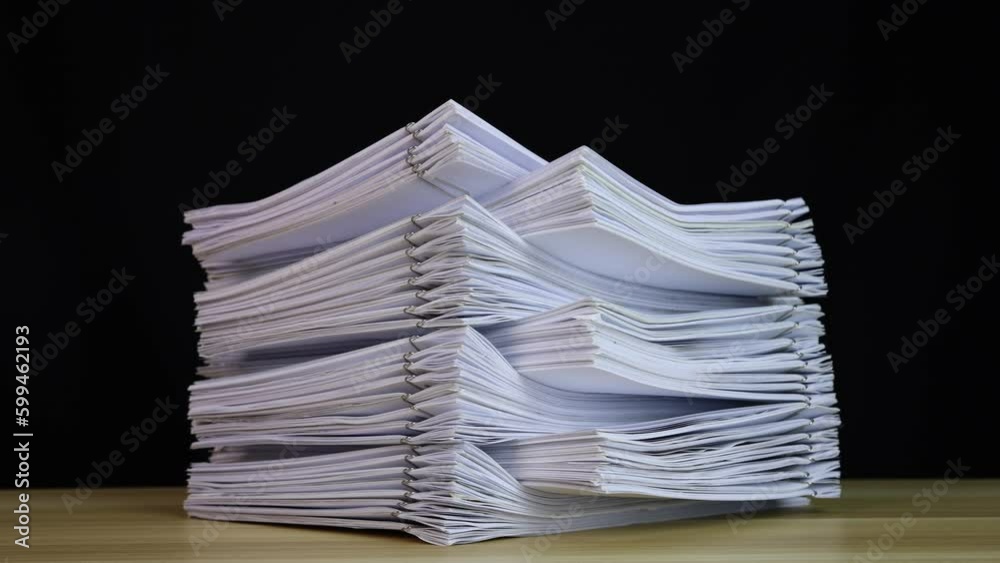 stack of paper documents with clip on a wooden table. Corporate business financial data management concept. Organize Documents – 4K Stop Motion, Stack Files Overload