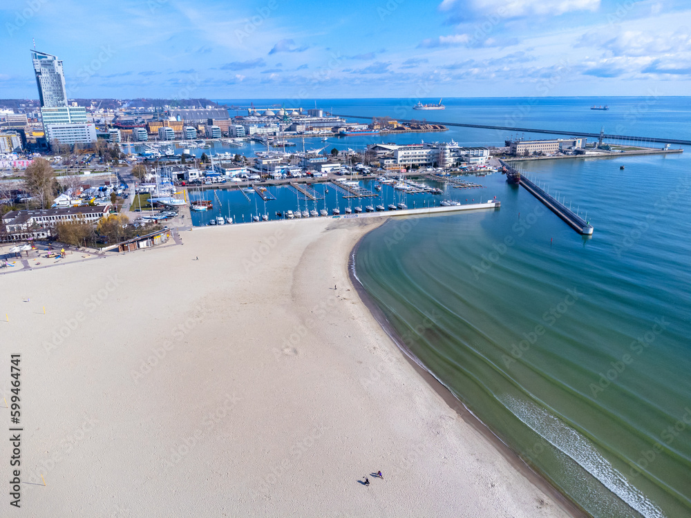 Aerial view landscape Poland Gdynia. City beach, view of marine and harbor. Empty beach, blue sky.
