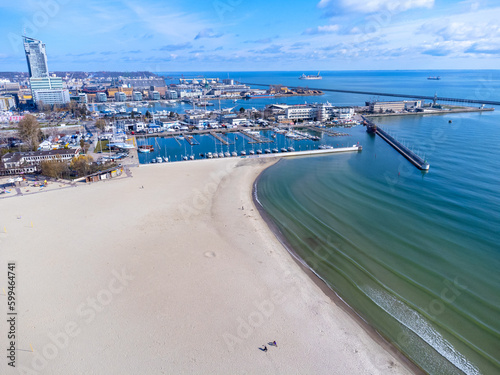 Obraz na płótnie Aerial view landscape Poland Gdynia. City beach, view of marine and harbor. Empty beach, blue sky. w salonie