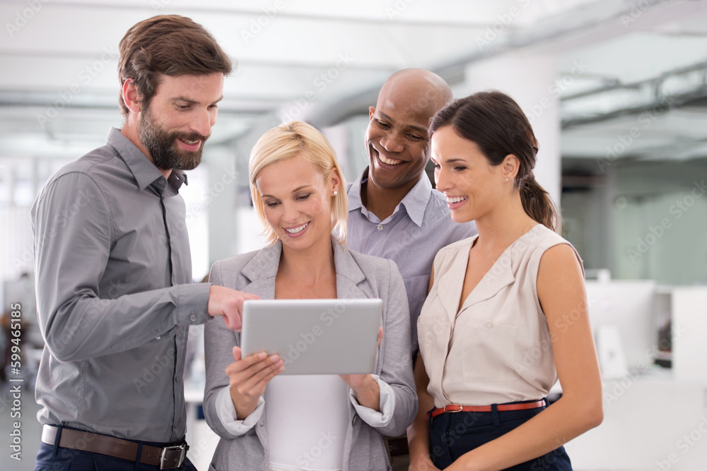 Theres no need for a board room. a group of businesspeople looking at a digital tablet. Theres no need for a board room. a group of businesspeople looking at a digital tablet.