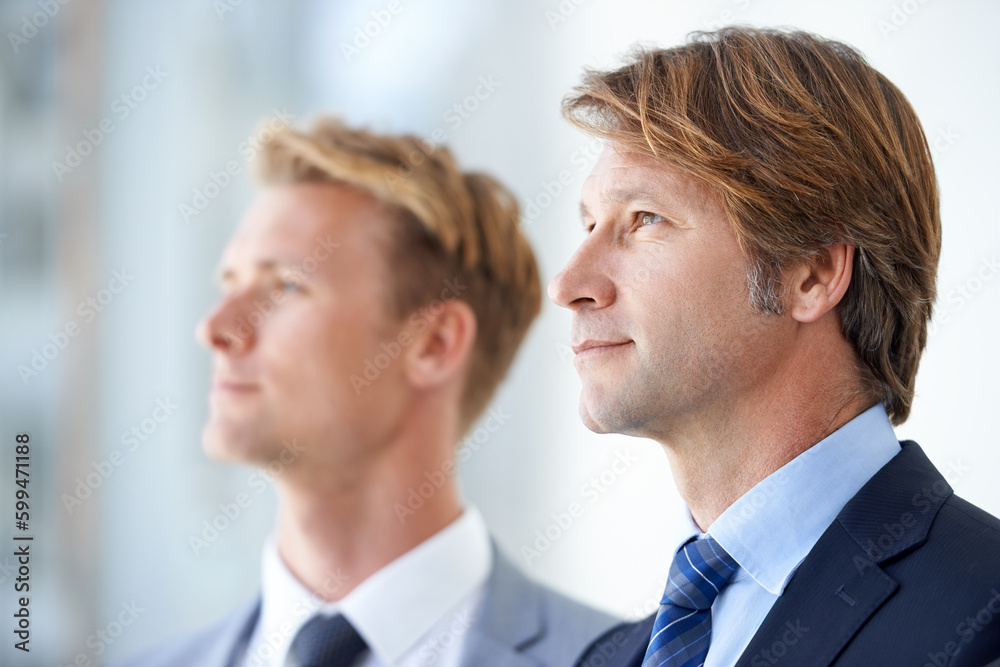 Looking towards the future. Two businessmen looking away into the distance. Looking towards the future. Two businessmen looking away into the distance.