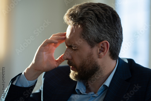 Tired, headache and eye strain. Businessman with stress, burnout and fatigue eyestrain. Mature middle aged senior man rubbing tired eyes. Vision problem, bad sight, feeling eyestrain fatigue pain.