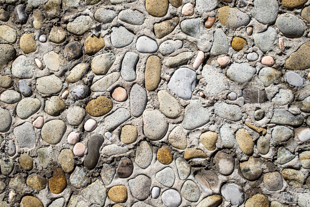 Wall background, round pebbles, like a wall. Wall background, round pebbles, like a wall.