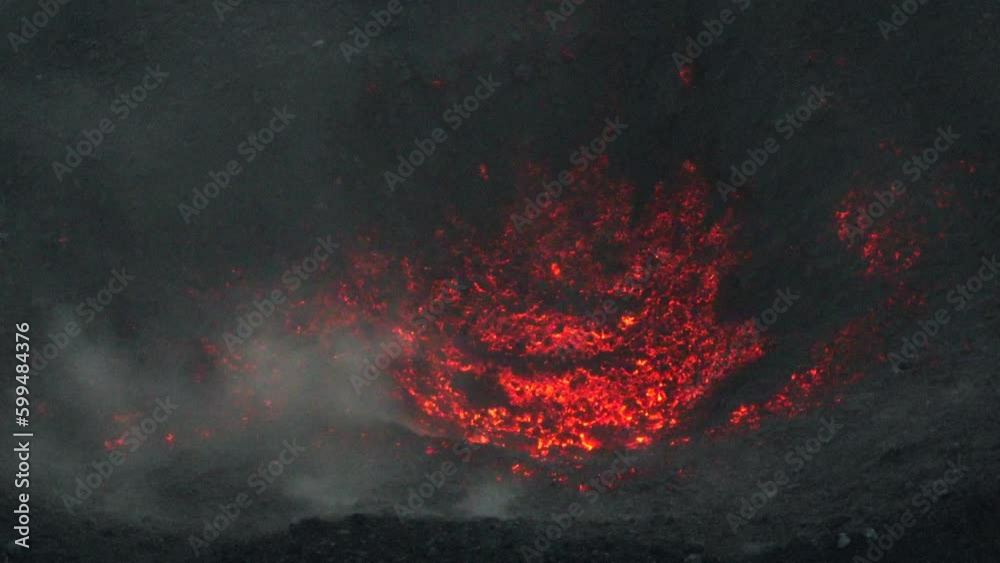 Close up aerial footage of the magma and red hot rock in the crater of the volcano Fuego in Guatemala