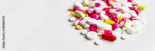 Frame of colorful antibiotic capsule pills. Antibiotic drug resistance concept. Pharmaceutical industry. Healthcare and medicine. Medical care.a lot of pills medicine isolated on white background