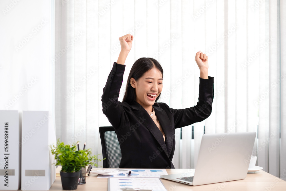 Smart business woman is sitting at workplace and glad that the work has been accomplished according to the goal. Smart business woman is sitting at workplace and glad that the work has been accomplished according to the goal.