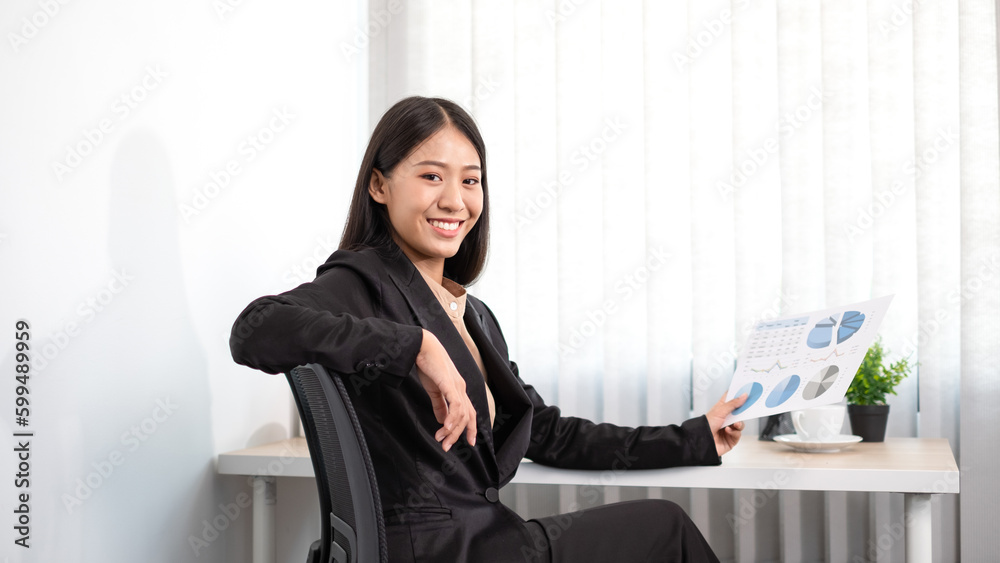 Beautiful young asia businesswoman is sitting at workplace and feeling ready for work all time. Beautiful young asia businesswoman is sitting at workplace and feeling ready for work all time.