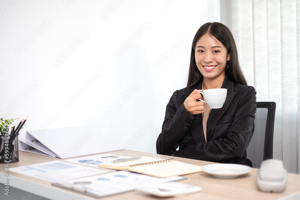 Beautiful young asia businesswoman is sitting at workplace and feeling ready for work all time. Beautiful young asia businesswoman is sitting at workplace and feeling ready for work all time.
