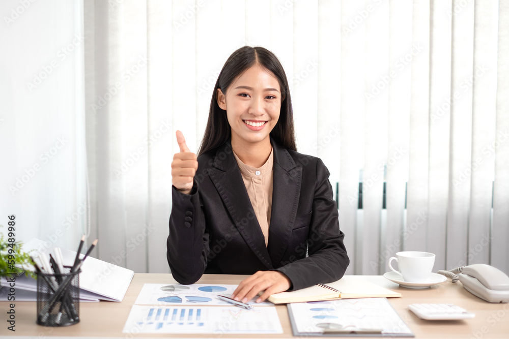 Beautiful young asia businesswoman is sitting at workplace and feeling ready for work all time. Beautiful young asia businesswoman is sitting at workplace and feeling ready for work all time.