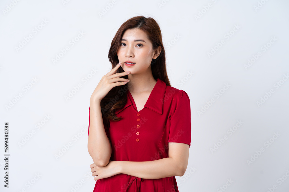 Portrait of a beautiful, charming lady wearing a red dress on a white background Portrait of a beautiful, charming lady wearing a red dress on a white background