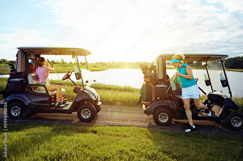 Getting together for golf. friends riding in a golf cart on a golf course.