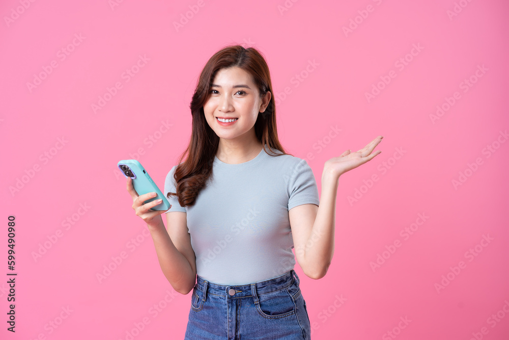 portrait of young asian girl posing on pink background portrait of young asian girl posing on pink background