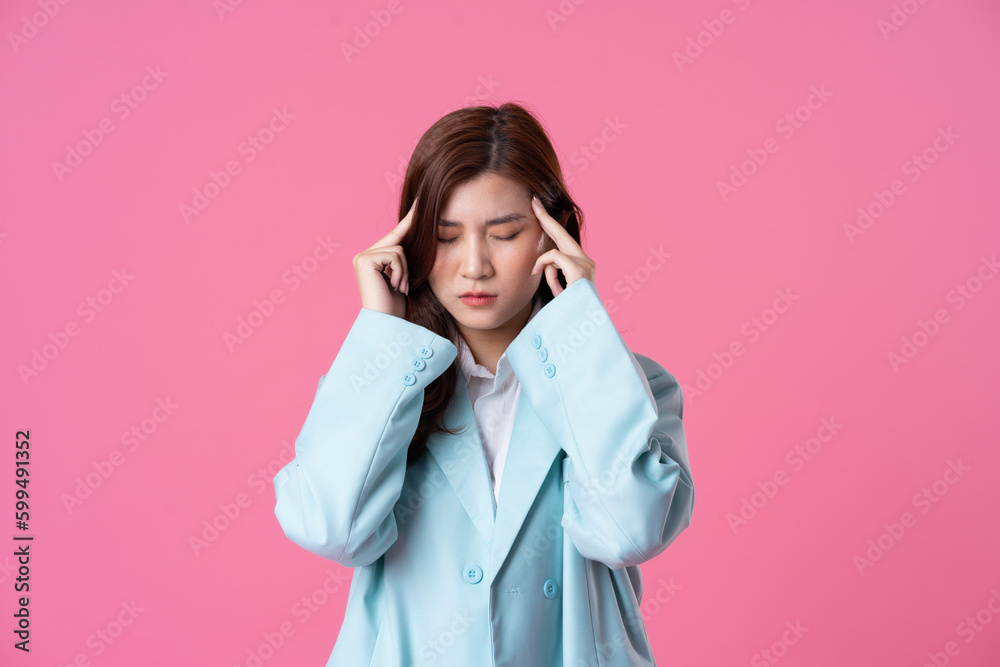 Asian businesswoman portrait on pink background Asian businesswoman portrait on pink background