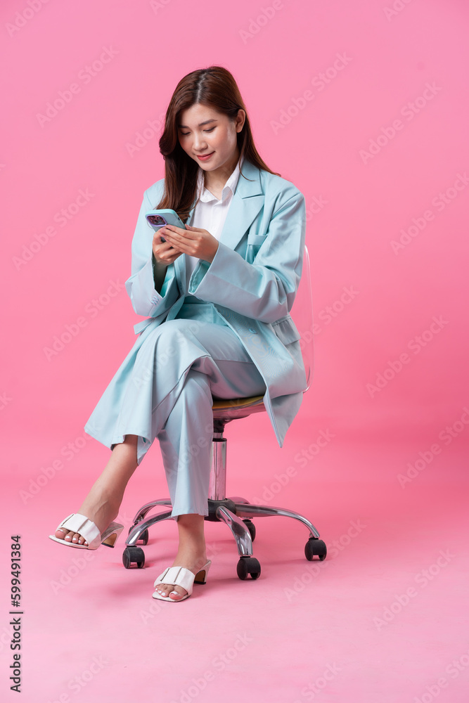 Asian businesswoman portrait on pink background Asian businesswoman portrait on pink background