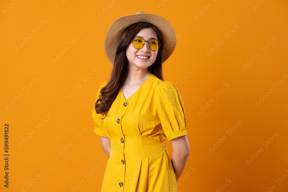 portrait of beautiful asian girl wearing yellow dress on orange background portrait of beautiful asian girl wearing yellow dress on orange background