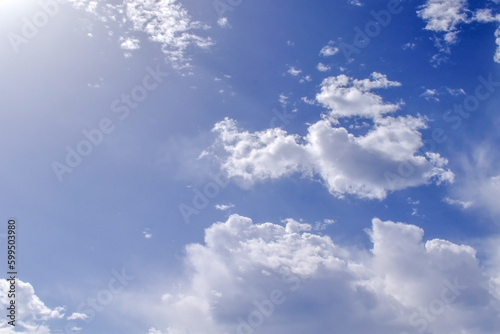Blue sky with white fluffy clouds. Cumulus clouds background. Cloudscape morning sky. The concepts of freedom of live, never give up and positive though energy. 