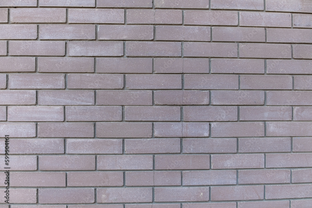 Dark gray brick wall as texture, background, pattern