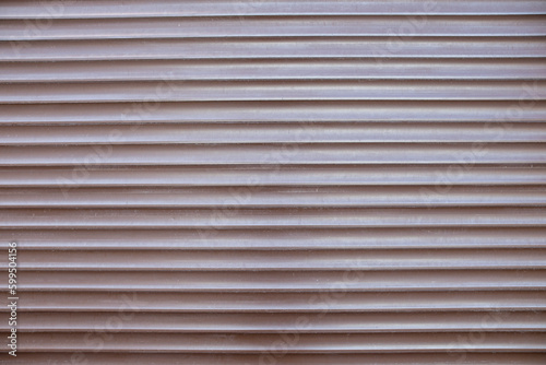 Brown metal-plastic entrance shutters to the store as a texture, background, template