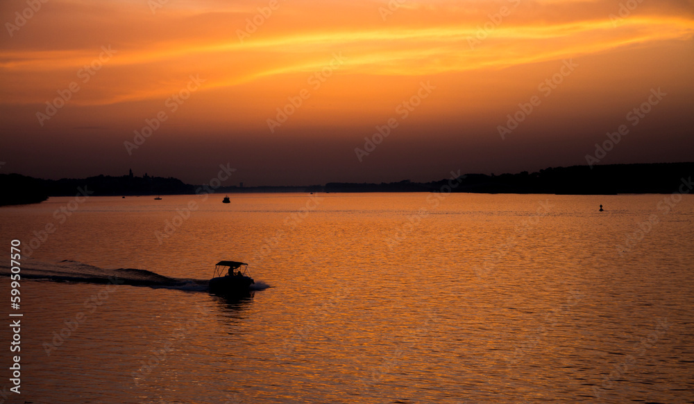 Beautiful Sunset on Danube River, quiet and calm Zemunski Kej, silhouette 
