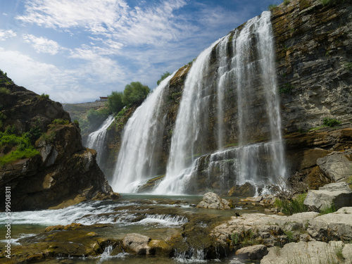 Beautiful big waterfall at day. Tortum Waterfall morning view. Uzundere, Erzurum, Türkiye 