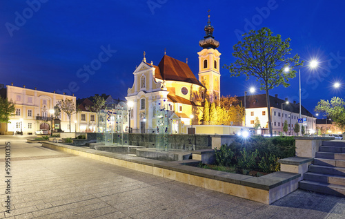 Hungary, Church in square in city Gyor at night