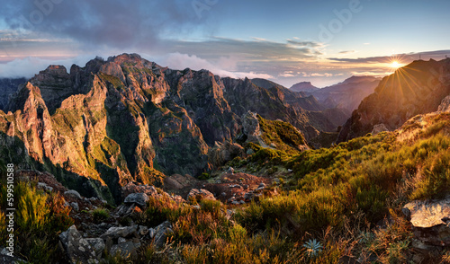 Mountain trail Pico do Arieiro, Madeira Island, Portugal Scenic view of steep and beautiful mountains and clouds during sunrise