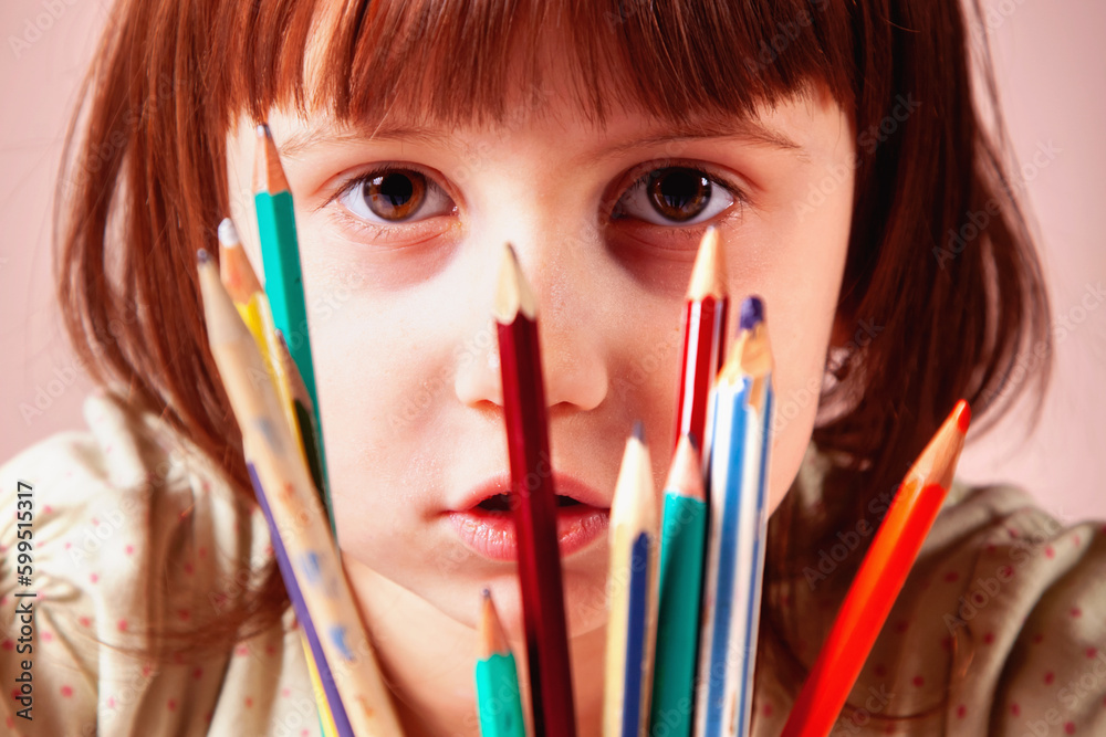 Close up portrait of young beautiful girl with pencils learning to paint. Close up portrait of young beautiful girl with pencils learning to paint.