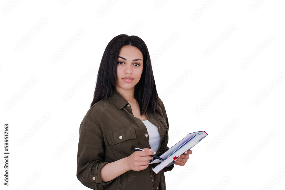 Pretty african american office manager, young businesswoman holds notebook and pen against transparent background with empty space looking at camera in dark shirt. Smart brazilian student girl Pretty african american office manager, young businesswoman holds notebook and pen against transparent background with empty space looking at camera in dark shirt. Smart brazilian student girl