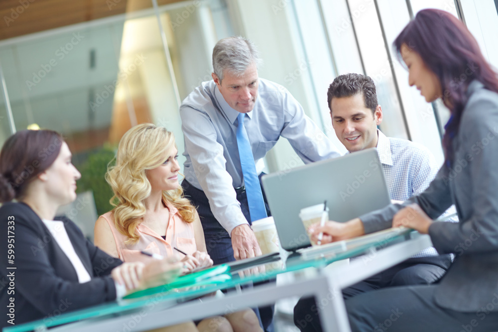 Time for the cash flow forecast. A group of businesspeople having a meeting while sitting around a conference table with a laptop. Time for the cash flow forecast. A group of businesspeople having a meeting while sitting around a conference table with a laptop.
