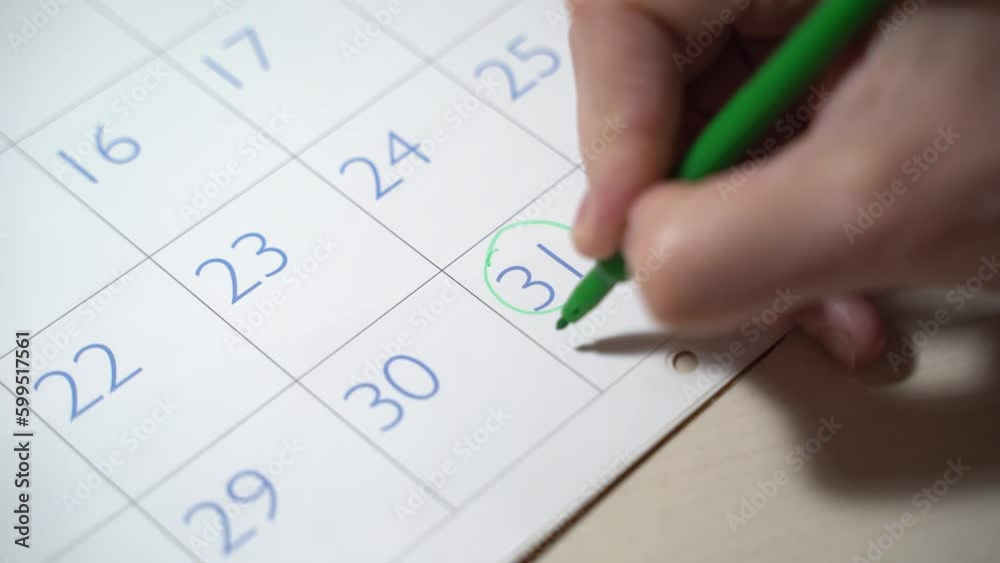 Girl marks December 31 on Calendar 2023. Happy new year date. Calendar with date of December 25 and gift box, paper's rools with star shaped christmas lights on light brown background. Christmas and Girl marks December 31 on Calendar 2023. Happy new year date. Calendar with date of December 25 and gift box, paper's rools with star shaped christmas lights on light brown background. Christmas and