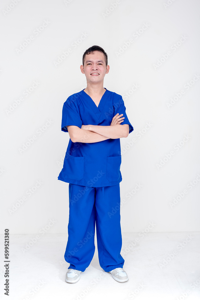 Portrait of a young and skilled medical student, nurse, intern posing with both hands crossed and folded. Isolated on a white background.