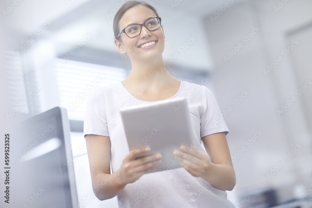 These numbers are better than I imagined. an attractive young businesswoman using a digital tablet. These numbers are better than I imagined. an attractive young businesswoman using a digital tablet.