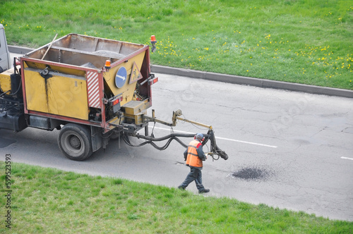 Street landscaping. Express repair of asphalt pavement using specialized equipment.