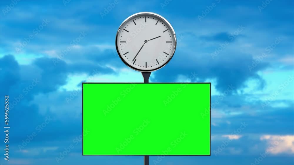 Clock and screen with chromakey on pole against clouds