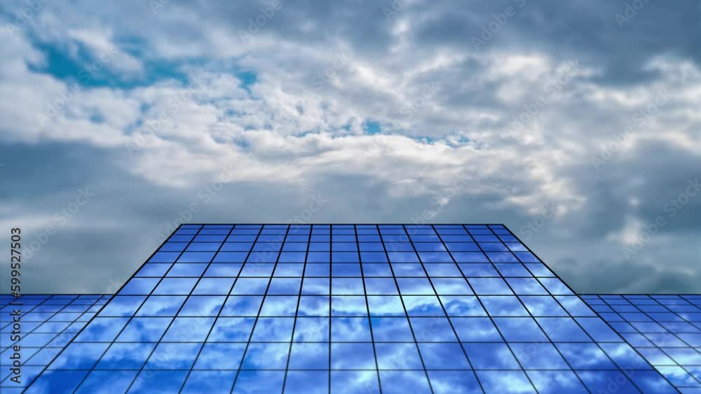 Heavy clouds float above walls with mirror solar panels Heavy clouds float above walls with mirror solar panels