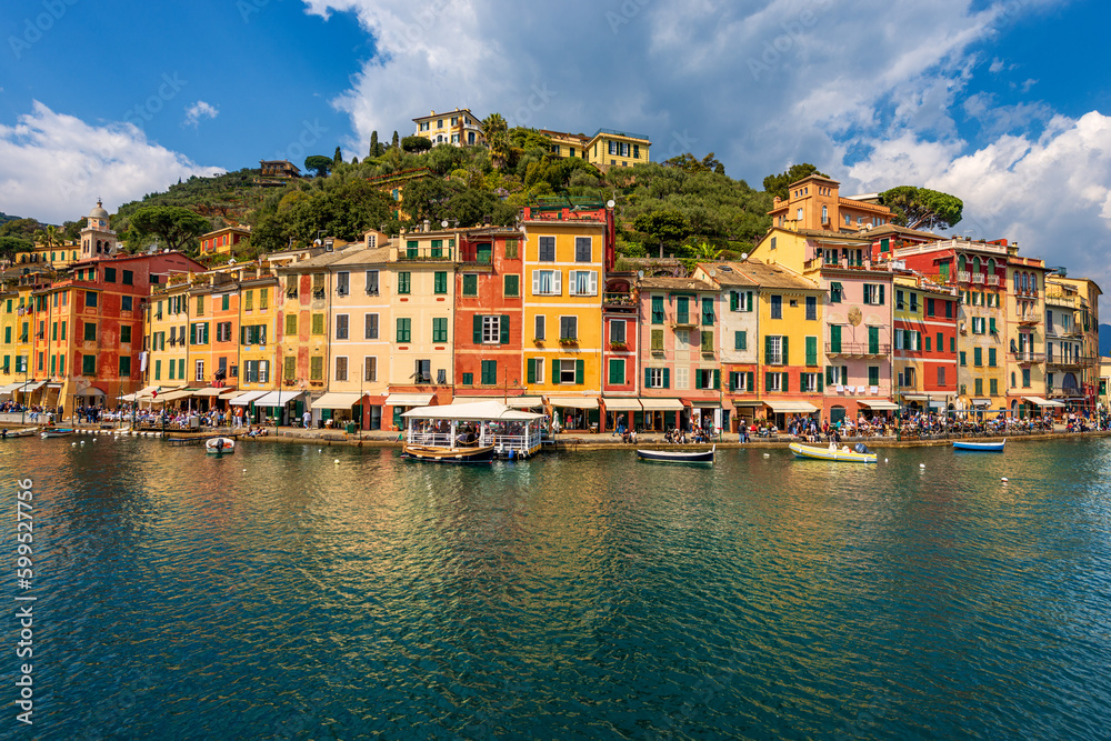 Colorful houses in the port of Portofino village, luxury tourist resort in Genoa Province, Liguria, Italy, Europe. Mediterranean sea (Ligurian sea).