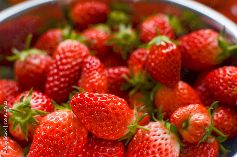 A lot fresh strawberries in a bowl. Freshly harvested. A lot fresh strawberries in a bowl. Freshly harvested.