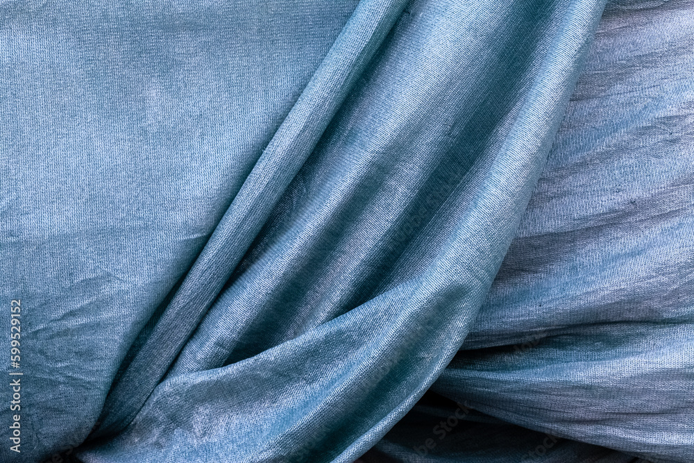 Blue satin texture. Grooved fabric background Blue satin texture. Grooved fabric background