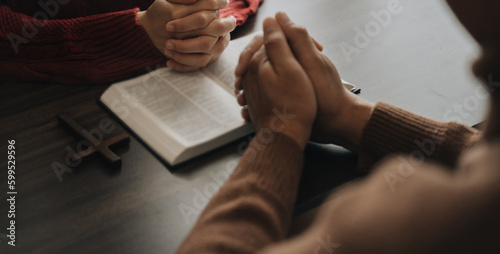 An Asian man is reading the scripture or holy bible. God's teachings according to belief and faith in God. Religion Concept - Image