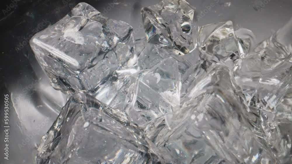 Water is poured into a glass with ice. Water is poured into a glass with ice.