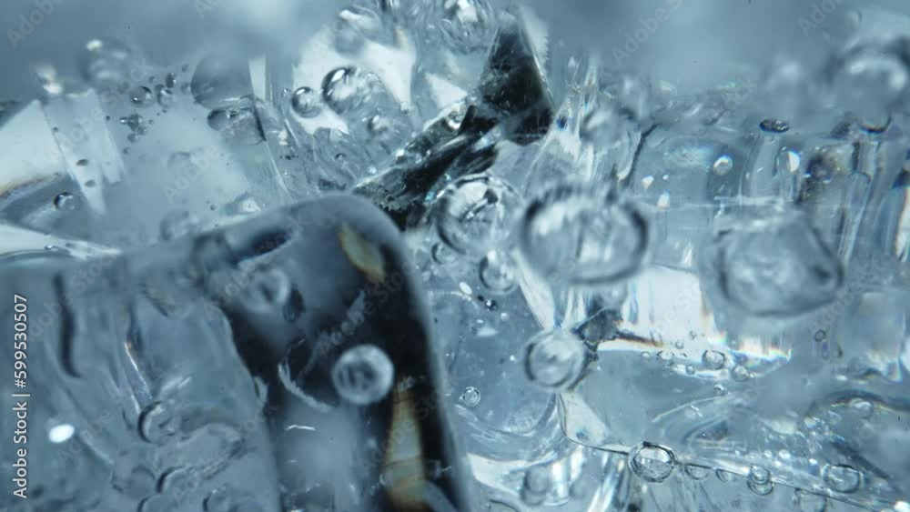 Water is poured into a glass with ice. Water is poured into a glass with ice.