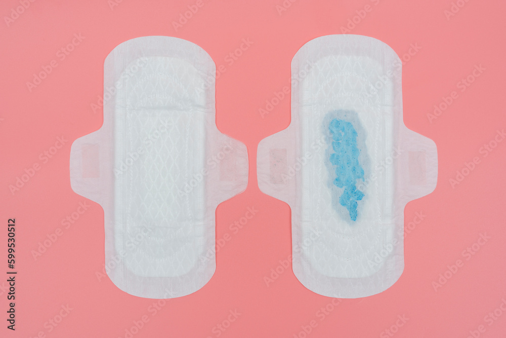 Sanitary pad compare with full amount of blue blood. Sanitary pad compare with full amount of blue blood.