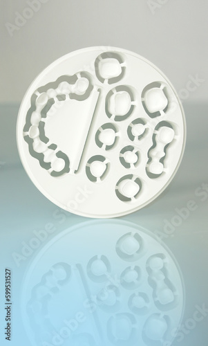 A milled ceramic round from dental technology for production of esthetic dental prosthesis dentures.
