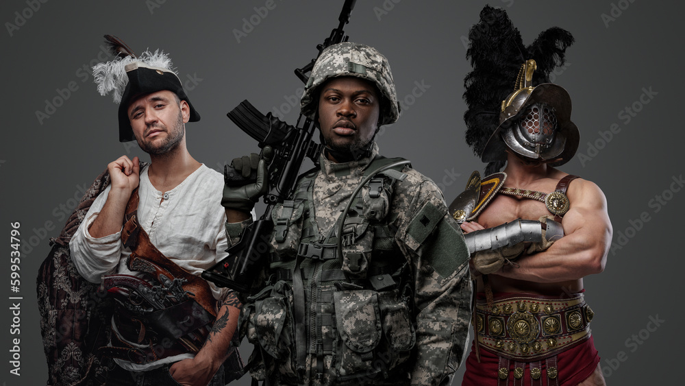 Studio shot of modern soldier of african ethnic and medieval gladiator with pirate.
