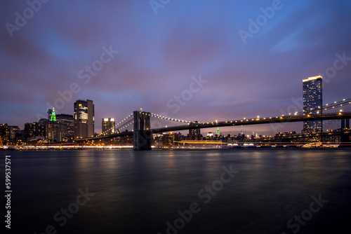 Manhattan skyline and Brooklyn bridge in New York at night