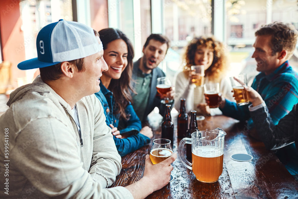 The best hangout spot with the best kind of people. a group of friends enjoying some beers at a bar. The best hangout spot with the best kind of people. a group of friends enjoying some beers at a bar.